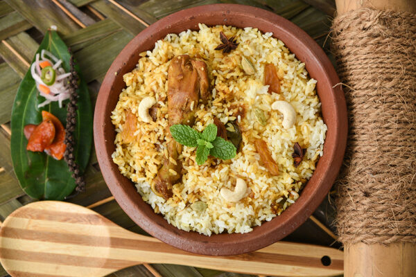 Chicken biryani/Hyderabadi Biriyani, Kerala India. Popular traditional dish/food  made using basmati/saffron/jasmine rice, various other exotic Indian spices/masala. served with pickle, salad, pappad.
